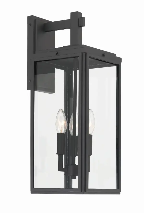 The Byron outdoor sconce combines modern design with transitional appeal through its clean lines and sharp angles. The tapered rectangular clear glass shade provides excellent illumination while the matte black finish adds contemporary sophistication to any exterior space.