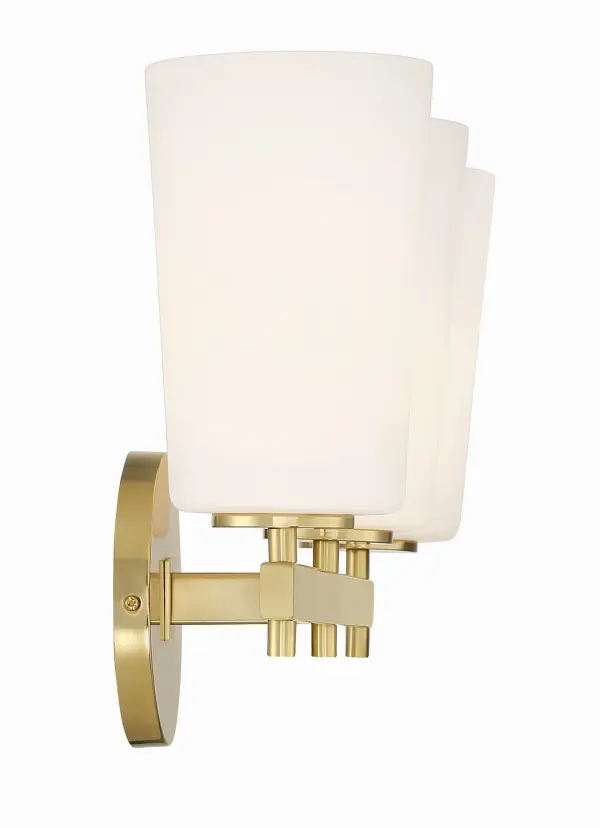 The Colton vanity light combines thoughtful simplicity with elegant design. Its distinctive opal white glass shade and aged brass finish create a warm, sophisticated look perfect for any bathroom style. - alternate view