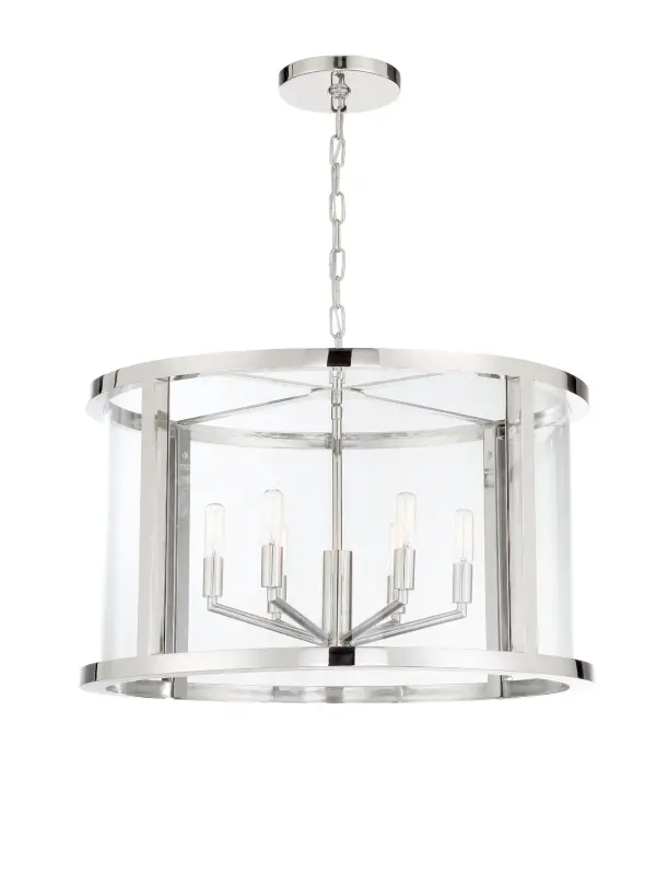 The Devon 24" Chandelier by Libby Langdon combines simple elegance with versatile design. Its polished nickel frame, clear glass panels, and angular candelabra arms create a sophisticated look that works across multiple design styles.