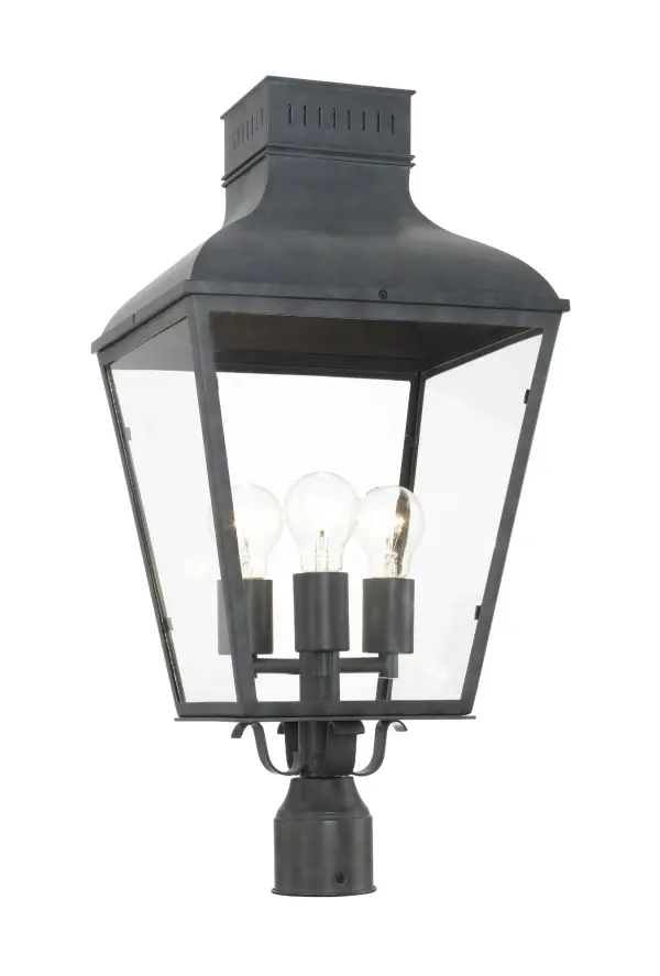 The Dumont outdoor post light brings vintage charm with its classic street lantern silhouette. Featuring durable steel construction in a sophisticated graphite finish and clear glass panels, it delivers old world elegance.