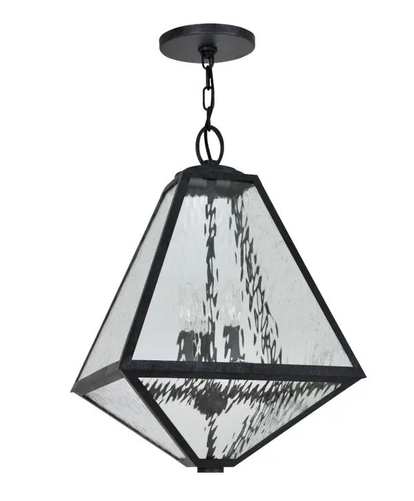 The Glacier Outdoor Pendant brings architectural drama to exterior spaces with its distinctive iceberg-inspired silhouette. Featuring angular chiseled lines, black charcoal finish, and white opal glass panels, this 14" fixture delivers sculptural modernist style with wet-rated durability for any outdoor application. - alternate view