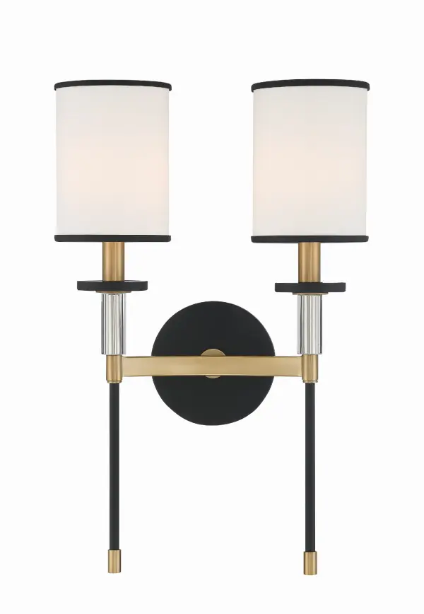 The Hatfield 12" Sconce combines classic angular lines with crystal accents and crisp white shades, creating a luxurious yet understated statement. Perfect for bathrooms and bedrooms, this versatile fixture brings timeless drama.