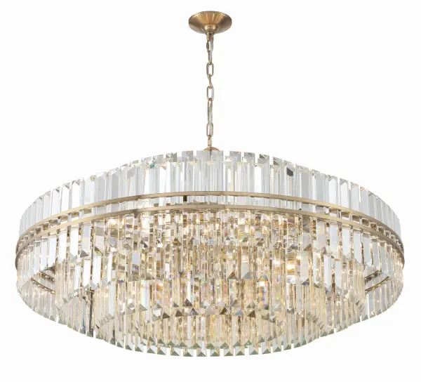 The Hayes 40.5" Chandelier is a breathtaking masterpiece featuring hand-cut crystals arranged in elegant tiers, held by a sleek aged brass steel frame. This oversized fixture transforms any space into a captivating focal point.