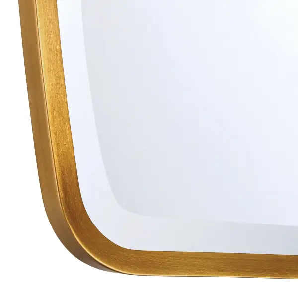 The Lindee Mirror combines sleek contemporary design with soft curved edges, creating a versatile accent piece. Its Antique Gold finish adds warmth and sophistication to any space while maintaining a minimalist aesthetic. - alternate view