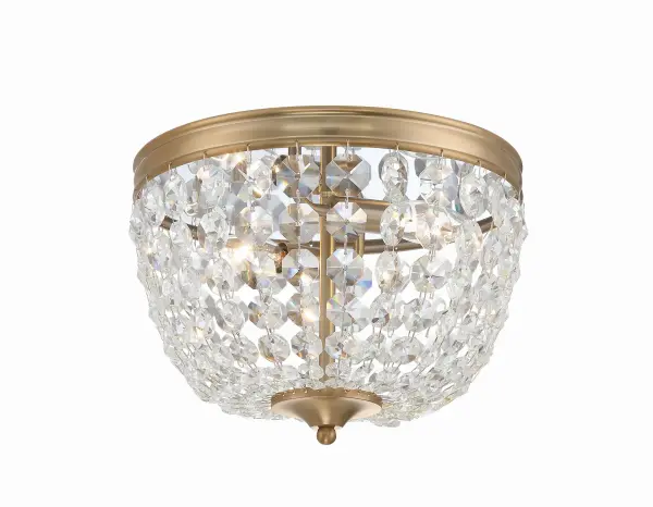 The Nola flush mount reimagines the timeless crystal basket design with clean lines and contemporary finishes. Its 11.5" profile makes it perfect for smaller spaces needing elegant overhead lighting with classic appeal. - alternate view
