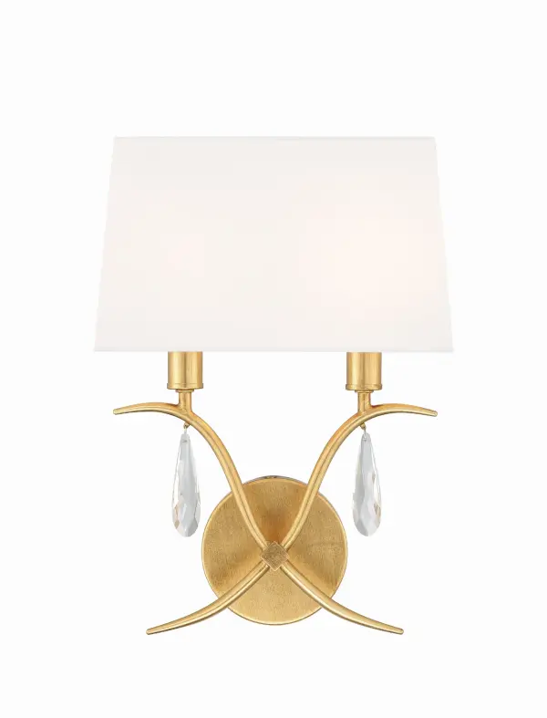 The Rollins sconce combines timeless elegance with versatile design. Hand-cut crystals and swooping metal arms create visual interest, while the tapered fabric shade softens the light. Perfect for traditional or transitional interiors.