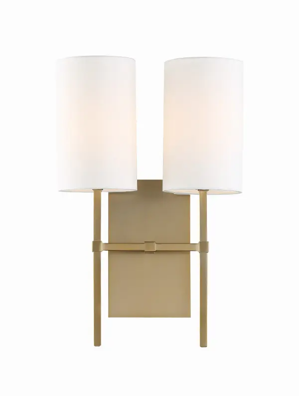 The Veronica sconce combines clean lines with an oversized drum shade for a sophisticated yet understated look. Its minimalist design and warm aged brass finish make it adaptable to various interior styles.