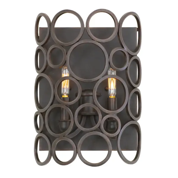 The Ashbourne Collection was inspired by playing with bangle bracelets. The seemingly random circles, available in two of Kalco`s exclusive finishes, are a modern take on lantern-style pendants. The open grid of Mid-Century Modern circles create a shell around a column of candelabra style bulbs to create a piece that truly makes a statement in any space. Collection: Ashbourne Rooms: Hallway, Bedroom, Living Room, Dining Room Finish: Heirloom Bronze Width: 10.00" Height: 14.00" Weight: 7.00 lb Extension from Wall: 4.00" Chain: 4` Wire: 6`` Mounting Height: 7.00" Canopy: 10``x12`` Number of Bulbs: 2 Maximum Wattage: 25.00 W Bulb Base: E12 Candelabra Dimmable Voltage: 120.00 V Material: Hand Forged Wrought Iron Country of Origin: Phillipines Safety Listing: cETL Safety Rating: Dry ADA