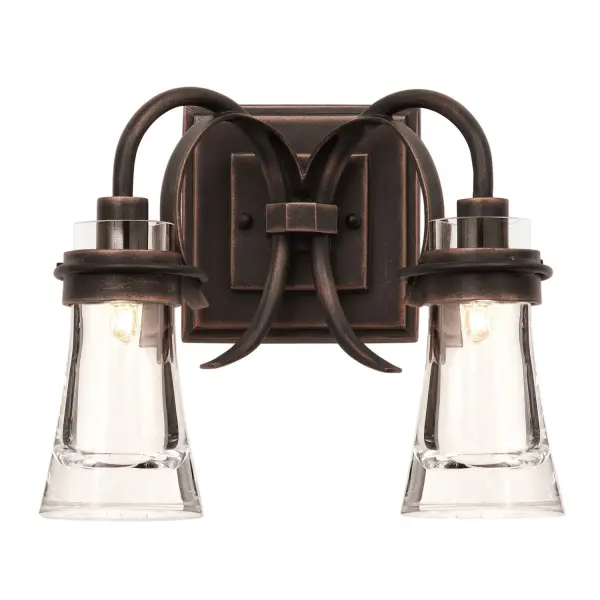 In the Dover Collection, the rectilinear forms of a typical Arts and Crafts Style wall bracket join perfectly with the organic curves of the Art Nouveau lighting arms. Combining this union of styles with Kalco's exclusive Antique Copper finish and hand-blown, clear glass shades creates a series of light fixtures that are simple yet make a statement. Collection: Dover Rooms: Bathroom, Vanity, Spa, Powder Room Finish: Antique Copper Width: 13.00" Height: 10.50" Weight: 9.00 lb Extension from Wall: 7.00" Wire: 6" Mounting Height: 3.25" Canopy: 6"x6"x1.25" Bulbs Included Number of Bulbs: 2 Maximum Wattage: 3.00 W Bulb Base: G9 Light Source: LED Light Output: 600.00 lm Color Temperature: 3000 K Dimmable Voltage: 120.00 V Material: Steel , Hand Blown Glass Country of Origin: Phillipines Safety Listing: cETL Safety Rating: Dry LED