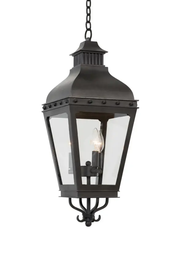 Timeless elegance is the look and feel of the Winchester Lantern Collection. Classic burner details on the crown, banding accented with hand crafted buttons, and the full bodied tapered frame make this a standout. Supplied with Clear Glass Panels and a Powder Coated Aged Iron Finish. Collection: Winchester Outdoor Rooms: Kitchen, Dining, Great Room, Foyer Finish: Aged Iron Width: 10.00" Height: 29.00" Weight: 24.00 lb Wire: 72`` Number of Bulbs: 3 Maximum Wattage: 40.00 W Bulb Type: Candelabra Bulb Base: E12 Candelabra Dimmable Voltage: 120.00 V Material: Aluminum , Glass Country of Origin: Phillipines Safety Listing: cETL Safety Rating: Wet