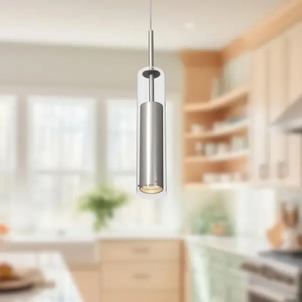 The Jarvis 3-inch pendant combines modern minimalism with warm metallic accents. Its compact cylindrical design features clear glass encasing a brushed gold aluminum housing, perfect for task lighting or clustered installations. - alternate view