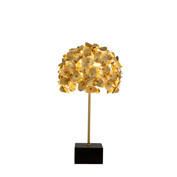Aster Collection brings the cheeriness of a bouquet of flowers into your home. A series of gold-plated metal discs are slightly bent and affixed to the end of rods of varying lengths for an orb effect, juxtaposing with the substantial black block base. Light eminates from within the "bouquet" creating an eye-catching display. Collection: Aster Finish: Gold Width: 15.00" Height: 26.00" Length: 15.00" Weight: 18.00 lb Wire: 60" Canopy: 6"x3"x6" Number of Bulbs: 3 Maximum Wattage: 40.00 W Bulb Type: Candelabra Bulb Base: E12 Candelabra Dimmable Voltage: 120.00 V Material: Steel Country of Origin: China Safety Listing: cUL Safety Rating: Dry