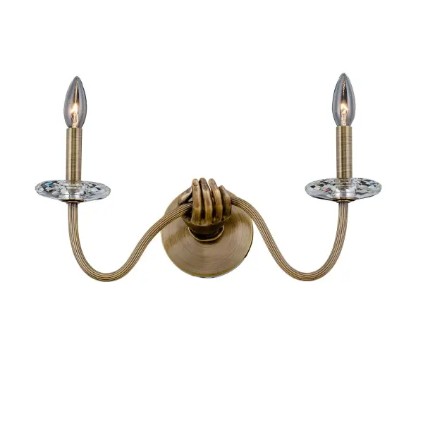 Inspired by the physical form and a sense of surrealism. Venus from the ILUMINE collection by Vanessa Deleon elicits curiosity for lighting as art. Cast brass crafted, featuring clear Firenze crystal florets and bobeches. Collection: Venus Rooms: Hallway, Bathroom, Bedroom, Foyer Finish: Historic Brass Width: 18.00" Height: 11.00" Length: 5.75" Weight: 5.00 lb Extension from Wall: 5.75" Wire: 7" Number of Bulbs: 2 Maximum Wattage: 60.00 W Bulb Type: E12 Bulb Base: E12 Candelabra Dimmable Voltage: 120.00 V Material: Cast Brass Country of Origin: China Safety Listing: UL-cUL Safety Rating: Dry