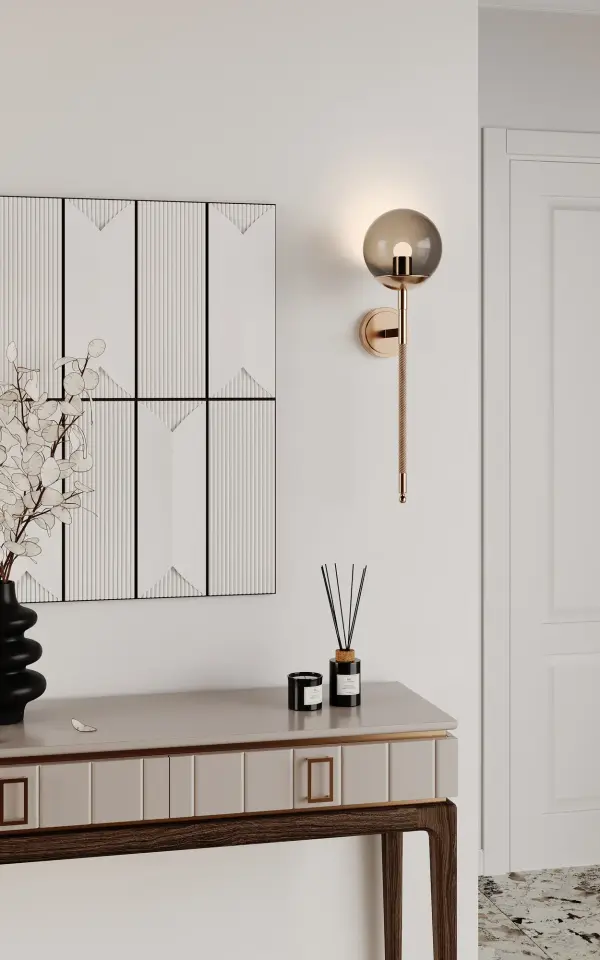 Unexpected surprise is what you will see and feel with the Boba Collection by Vanessa Deleon for Kalco Lighting. Deep curves, genuine leather wrapped arms, and custom geometric chain are just the beginning. Featuring a smoked glass globe with a center acrylic diffuser to cover the LED lamps. Collection: Boba Rooms: Bathroom, Bedroom, Living Room, Finish: Winter Brass Width: 7.00" Height: 26.00" Weight: 6.61 lb Extension from Wall: 7.75" Wire: 12" Canopy: 5"x0.75" Bulbs Included Maximum Wattage: 4.00 W Bulb Type: LED Light Source: LED Light Output: 280.00 lm Color Temperature: 3000 K CRI: 90 Dimmable Voltage: 120.00 V Material: Steel, Glass, Leather, Acrylic Country of Origin: China Safety Listing: UL-cUL Safety Rating: Dry LED - alternate view