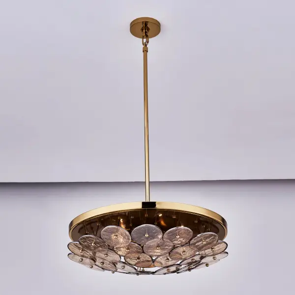 Enhance your space with the Hortensia Collection, which brings warmth and makes a bold statement through its abstract, geometric layering of overlapping glass circles that create captivating textures and magnify light in intriguing ways. Available in a Polished Winter Brass finish paired with gold glass, it tells a warm and inviting color story. Inspired by Mid-Century Modern aesthetics, the sleek design provides versatile options for mounting heights and design applications. _________________ Collection: HORTENSIA Finish: Polished Winter Brass Width: 24.50" Height: 18.00" Weight: 33.00 lb Wire: 96" Rod: (1) 6", (1) 12", (1) 24" Canopy: 5"x1" Number of Bulbs: 5 Maximum Wattage: 40.00 W Bulb Type: Candelabra Bulb Base: E12 Candelabra Dimmable Voltage: 120.00 V Material: Iron and Glass Country of Origin: China Safety Listing: UL-cUL Safety Rating: DAMP