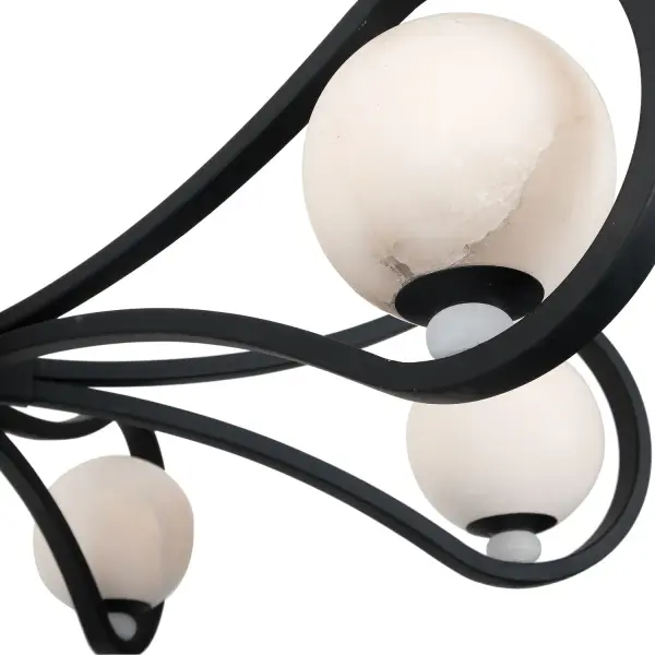Explore the timeless elegance of Elliptical. Crafted with Alabaster stone globes and clean flowing lines. The Matte Black finish adds a dash of distinction with looping forms that naturally draw your eye in. When lit, the balanced orbs cast a relaxed yet captivating glow. Collection: Elliptical Rooms: Living Room, Bedroom, Dining Room, Finish: Matte Black Width: 36.50" Height: 26.00" Length: 36.50" Wire: 96" Rod: (1) 6", (1) 12", (1) 24" Canopy: 5"x1.5" Bulbs Included Number of Bulbs: 6 Maximum Wattage: 4.00 W Bulb Type: G9 Bulb Base: G9 Light Source: LED Dimmable Voltage: 120.00 V Material: Steel, Alabaster Country of Origin: Philippines Safety Listing: UL-cUL Safety Rating: Dry LED - alternate view
