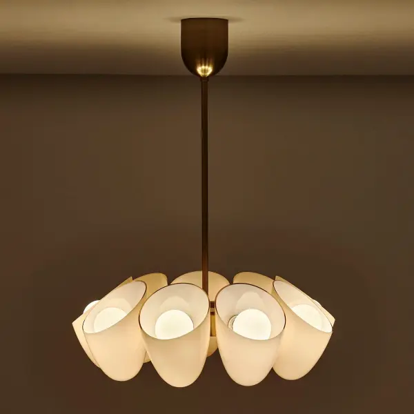 Drawing inspiration from silk cocoons, the Cocoon Collection showcases organically angled oval forms paired with Sakura Pink glass, delicately backed by a layer of soft white glass. Featuring a G30 globe light bulb, the design elegantly blends softness with geometric precision. Each piece is meticulously handcrafted from stainless steel and finished in a refined Winter Brass. _________________ Collection: COCOON Finish: Winter Brass Width: 28.00" Height: 20.50" Weight: 33.00 lb Wire: 96" Rod: (1) 6", (1) 12", (1) 24" Canopy: 5"x6" Number of Bulbs: 9 Maximum Wattage: 40.00 W Bulb Type: E26 Bulb Base: E26 Medium Dimmable Voltage: 120.00 V Material: Iron and Glass Country of Origin: China Safety Listing: ETL-CETL Safety Rating: DAMP - alternate view