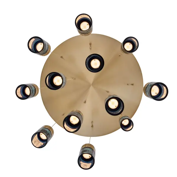 Inspired by the traditional Japanese craft of Edo Kiriko, the indigo colored 24% lead crystal diffusers of this fixture family features precise, herringbone cuts that reveal a clear layer underneath. The aluminum, Winter Brass (WB) body holds each glass in place, and the LED light sources provide ample downlight, adding a functional, yet colorful statement fixture to any space. Collection: Kiriko Finish: Winter Brass Width: 30.00" Height: 8.50" Length: 30.00" Weight: 64.00 lb Wire: 156" Canopy: 2"x30" Bulbs Included Number of Bulbs: 12 Maximum Wattage: 6.00 W Light Source: LED Light Output: 500.00 lm Color Temperature: 2700 K CRI: 90 Dimmable Voltage: 120.00 V Material: Iron, Brass, Aluminum, Crystal Country of Origin: China Safety Rating: Dry Switch: Correlated Color Temperature LED Instructions - alternate view