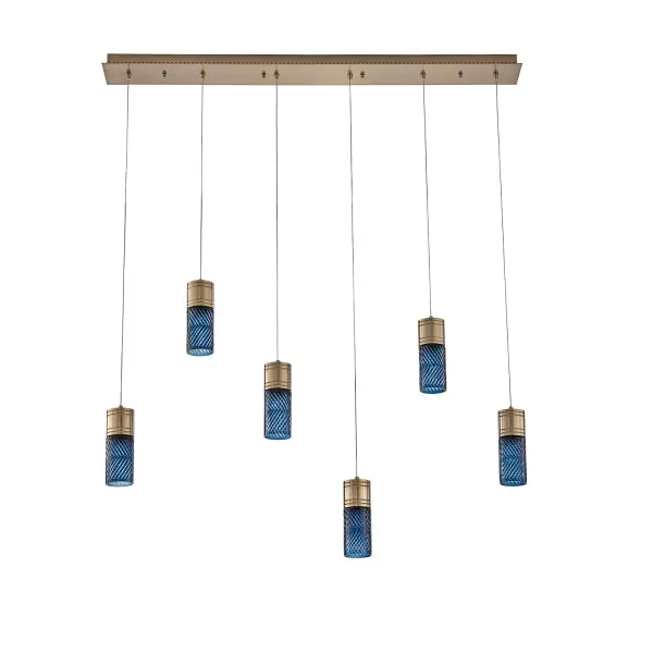 Inspired by the traditional Japanese craft of Edo Kiriko, the indigo colored 24% lead crystal diffusers of this fixture family features precise, herringbone cuts that reveal a clear layer underneath. The aluminum, Winter Brass (WB) body holds each glass in place, and the LED light sources provide ample downlight, adding a functional, yet colorful statement fixture to any space. Collection: Kiriko Finish: Winter Brass Width: 5.50" Height: 8.50" Length: 48.00" Weight: 35.00 lb Wire: 156" Canopy: 1.375"x5.5"x48" Bulbs Included Number of Bulbs: 6 Maximum Wattage: 6.00 W Light Source: LED Light Output: 500.00 lm Color Temperature: 2700 K CRI: 90 Dimmable Voltage: 120.00 V Material: Iron, Brass, Aluminum, Crystal Country of Origin: China Safety Rating: Dry Switch: Correlated Color Temperature LED Instructions