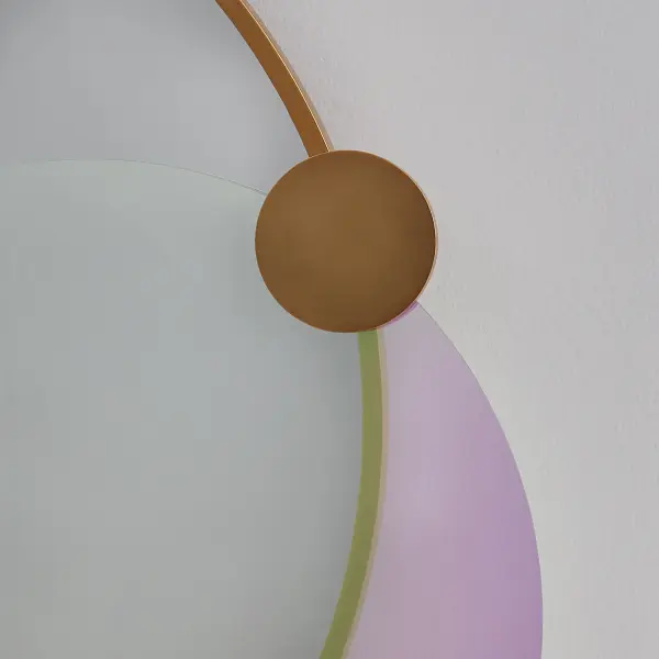 Transform your space with a touch of elegance and craftsmanship! The Colorways mirror in a stunning True Brass finish, adorned with two dazzling dichroic glass rounds, is a masterpiece that adds a sophisticated flair to any room. Perfect for those who appreciate find design, this mirror not only reflects light but also enhances the beauty of your home. Constructed from high-quality materials, this mirror is both durable and stylish. The 36 inch diameter is perfect for making a bold statement without overwhelming your space. Ideal for living rooms, entryways, or bedrooms, it provides both functionality and a decorative accent that can enhance any interior design. Easy to mount, it will reflect light beautifully, brightening up your home effortlessly. Collection: Colorways Finish: True Brass Width: 36.00" Height: 40.00" Extension from Wall: 3.00" Canopy: 20"x1" Material: Brass Wood Glass Mirror Country of Origin: China Safety Rating: Damp - alternate view