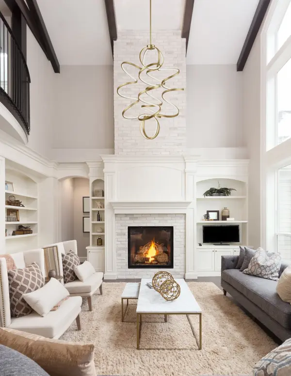 The Synergy chandelier features a striking continuous helical loop design with integrated LED lighting. Its rolled rectangular aluminum extrusion with silicon opal lens creates soft, even illumination while showcasing the antique finish from every angle. - alternate view