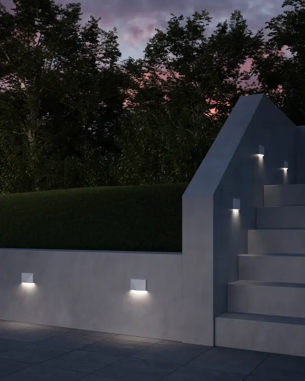 The Lio step light combines decorative geometric forms with functional downlighting. Its compact 3-inch design fits standard single gang boxes while delivering warm 3000K LED illumination for outdoor spaces. - alternate view