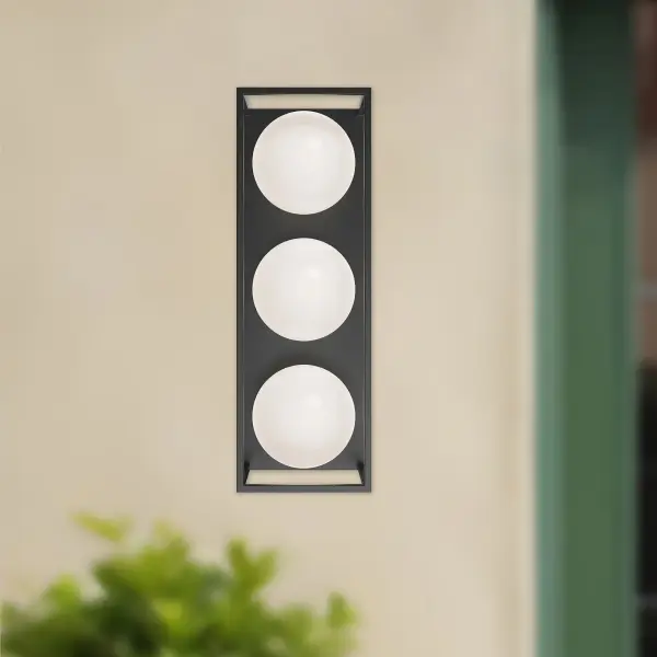 The Amelia wall sconce brings 1920s architectural glamour to modern homes with striking geometric patterns, rich matte black finish, and elegant opal glass accents. Versatile enough for both interior and exterior use. - alternate view