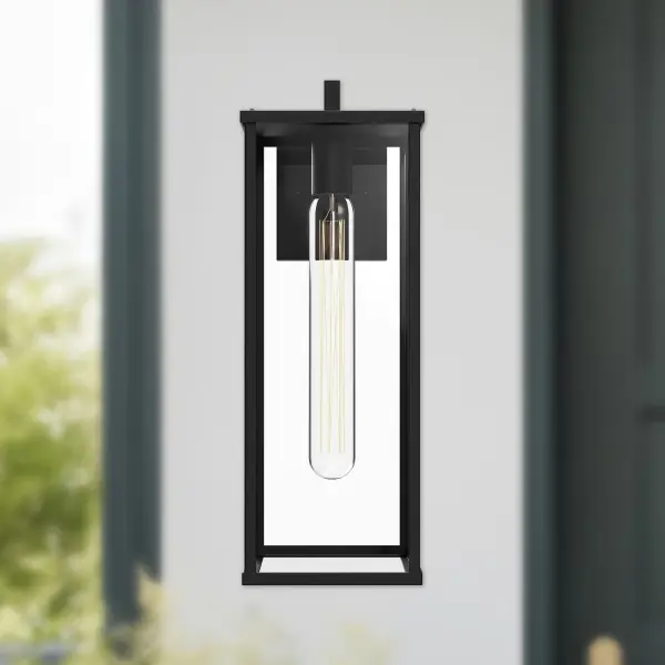 The Brentwood 17" wall sconce combines clean architectural lines with ample clear glass for sophisticated outdoor ambiance. Its textured black finish and modern design make it versatile for various exterior settings. - alternate view