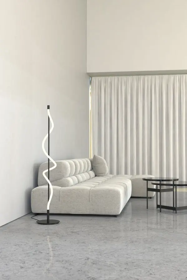 The Cursive floor lamp combines artistic acrylic forms with integrated LED technology to create soft ambient lighting. Its minimal footprint and contemporary aesthetic make it ideal for modern spaces requiring both function and style. - alternate view