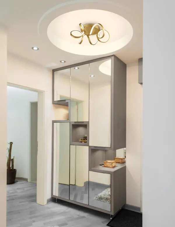 The Synergy flush mount features a distinctive looping radiant line that creates a continuous helical light path. Its rolled rectangular aluminum extrusion with silicon opal lens delivers soft, even illumination perfect for contemporary spaces. - alternate view