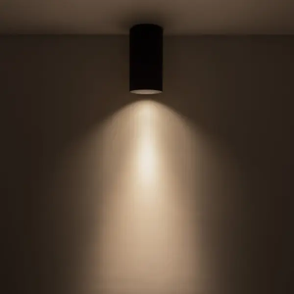 The Lorna flush mount delivers minimalist design with architectural precision. Its compact 4-inch diameter cylinder and 8-inch height make it ideal for tight spaces requiring focused downlighting with universal voltage compatibility. - alternate view