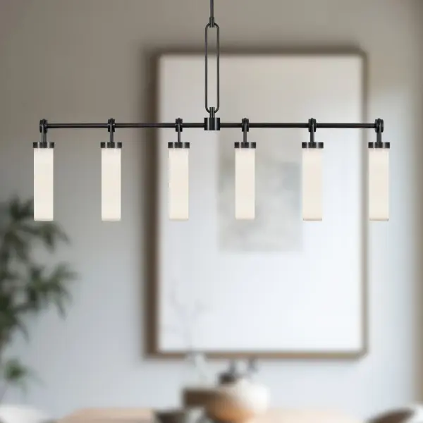 The Wynwood Linear Pendant blends industrial hardware with soft opal glass for a sophisticated vintage-modern aesthetic. At 52 inches, it's perfectly scaled for dining tables and kitchen islands, featuring meticulous metal loop details that add character and warmth to any space. - alternate view