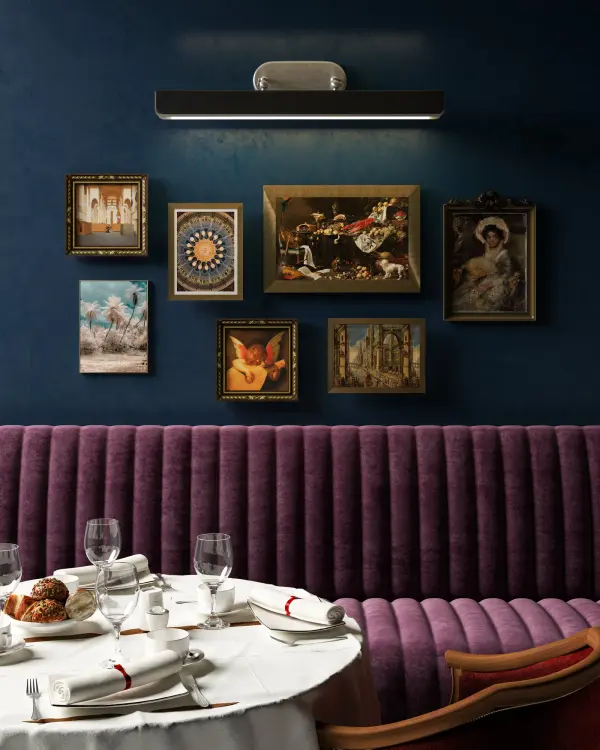 The Valise Picture Light combines vintage brass finish with cognac vegan leather for a sophisticated look. Its 32-inch width makes it ideal for highlighting larger artwork, while integrated LED provides energy-efficient illumination. - alternate view