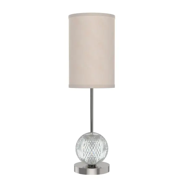 The Marni table lamp combines glamorous cut crystal detailing with warm brass accents and a sophisticated white linen shade. Features integrated LED technology with dual illumination from both shade and crystal base.