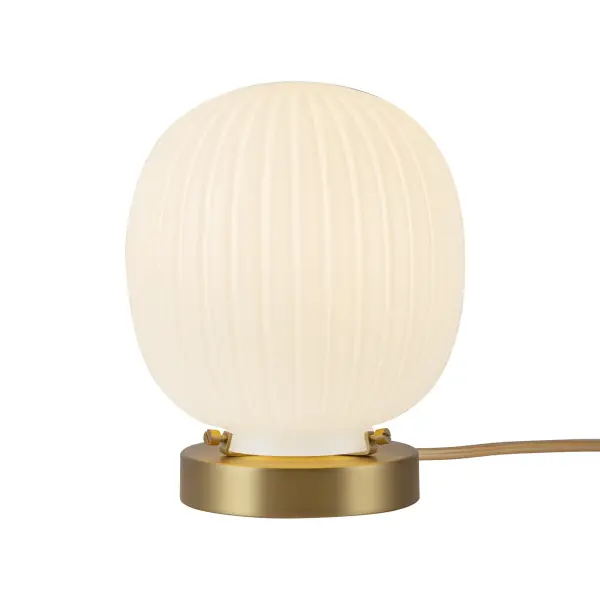 The Cherise Table Lamp brings 1920s candy shop nostalgia to life with its distinctive bonbon-shaped ribbed opal glass shade. The matte black finish paired with glossy ribbed glass creates a sophisticated contrast that works beautifully in both traditional and contemporary settings.