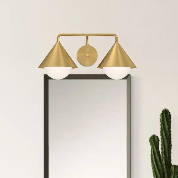 The Remy vanity light brings Japandi design to your bathroom with distinctive triangular shades and a sophisticated matte black finish. Gold interior detailing adds warmth while the opal glass provides soft, flattering illumination. - alternate view