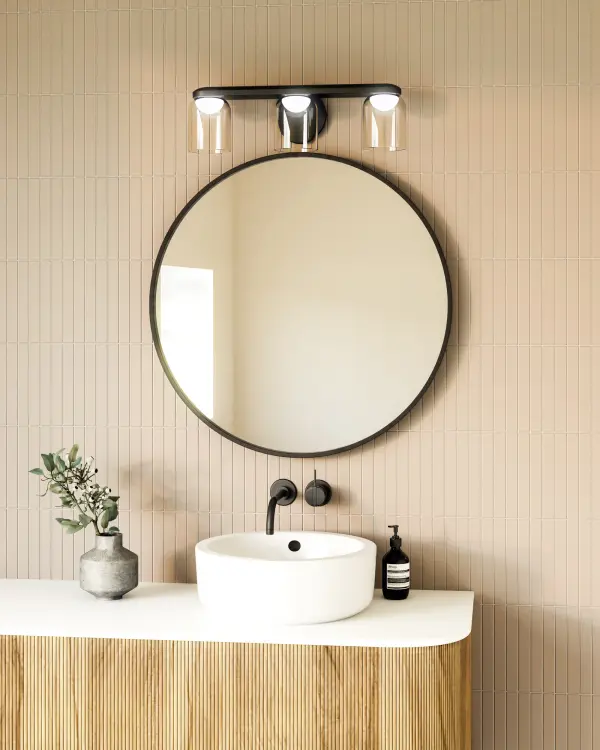 The Cedar vanity light combines whimsical frosted diffusers with clear glass shades for a sophisticated layered look. Integrated LED technology provides warm 3000K lighting, while the brushed gold finish adds contemporary elegance to any bathroom or powder room. - alternate view