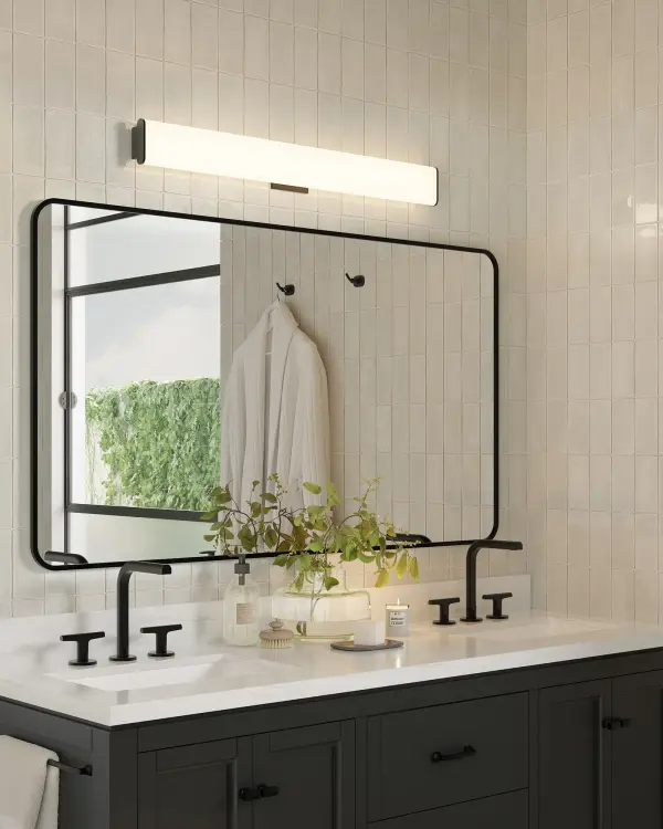The Ferguson vanity light combines geometric minimalism with practical versatility. Its 36-inch extruded diffuser provides even, warm LED illumination while the sliding lamp assembly allows custom positioning during installation. - alternate view