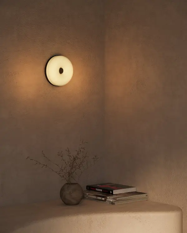 The Jada 5-inch wall sconce combines contemporary minimalism with practical LED technology. Its rounded opal glass diffuser delivers even, warm light perfect for hallways, bathrooms, and entryways. - alternate view