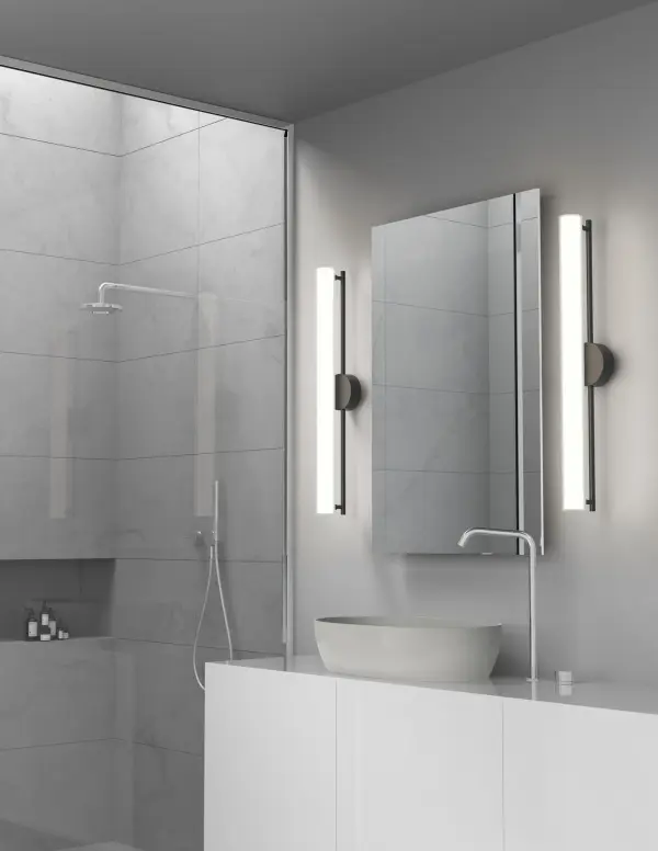 The Gramercy wall sconce features frosted glass cylinders arranged around a die-cast aluminum body, delivering even ambient lighting. With integrated LED, touch dimming, and a sleek matte black finish, it's ideal for modern bathrooms and hallways. - alternate view