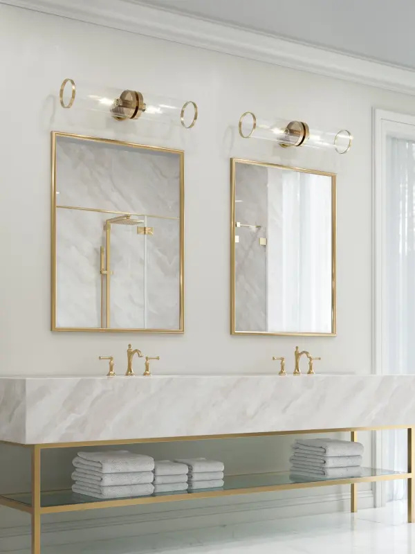 The Revolve II combines classic elegance with modern design through dramatic oversized clear glass shades and a stunning natural brass finish. Perfect for bathrooms and entryways, this versatile 28-inch fixture can be mounted horizontally or vertically. - alternate view