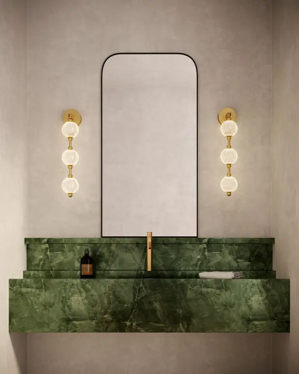 The Marni vanity light features meticulously cut spherical glass shades that create stunning beams of light, adding luxury and visual interest to bathrooms and hallways. Integrated LED with warm 3000K lighting. - alternate view