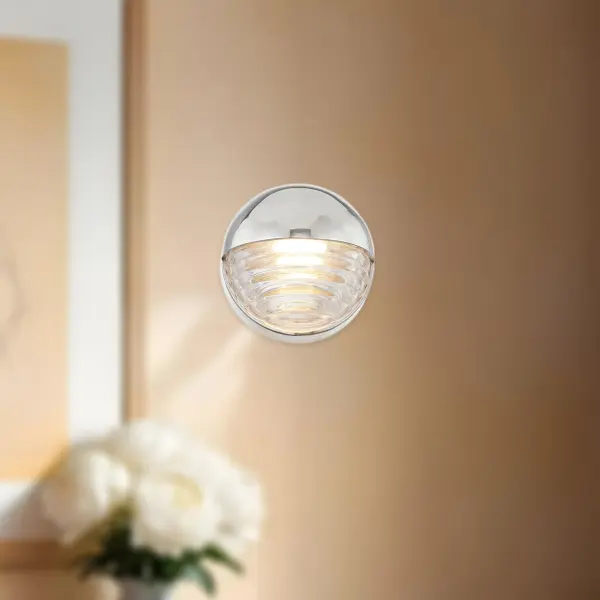 The Palais 6-light vanity fixture brings Art Deco elegance to modern bathrooms with its curved solid brass frame and ribbed glass shades. Integrated LED with warm 3000K lighting creates a sophisticated ambiance while being energy-efficient and dimmable. - alternate view