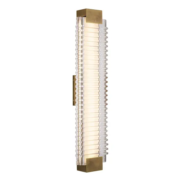 The Alai vanity light brings ocean-inspired elegance to your bathroom with its distinctive ribbed glass design and warm vintage brass finish. Integrated 2700K LED provides energy-efficient illumination with dimmable functionality.