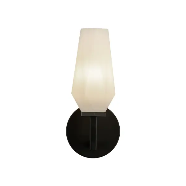 The Krysta vanity light combines clean geometric lines with faceted opal glass that creates stunning light refraction patterns. Its matte black finish and sculptural design bring contemporary sophistication to bathrooms and hallways.