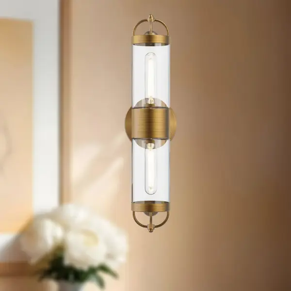 The Lancaster vanity light brings vintage Parisian lantern charm to contemporary spaces with generous glass panels and aged gold finish. Perfect for bathrooms and entryways seeking classic sophistication with versatile mounting options. - alternate view