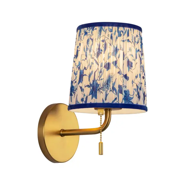 The Scout Wall Sconce combines whimsical metalwork with patterned pleated linen shades for character-filled lighting. Features a convenient pulley switch perfect for bedside use, delivering soft ambient illumination.