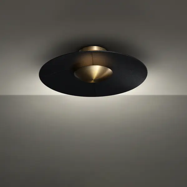 The Brody combines contemporary minimalism with artisanal details through its topstitched faux leather disc and luminous brass frame. High-CRI LED technology delivers warm, flattering light ideal for modern interiors.