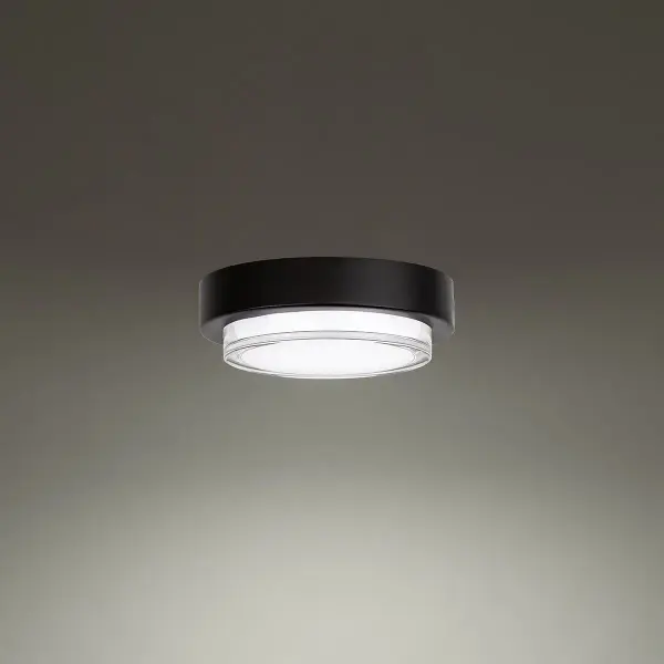 The Kind outdoor flush mount combines contemporary minimalist design with practical LED technology. Its compact 8" profile and shatter-resistant acrylic shade make it ideal for covered outdoor spaces requiring reliable, energy-efficient lighting.