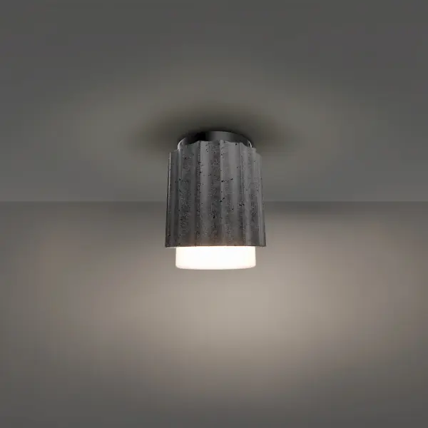 The Caviar Flush Mount combines natural basalt stone texture with refined LED technology. Its compact 7-inch profile features a fluted stone shade surrounding etched opal glass, creating warm ambient lighting ideal for intimate spaces.